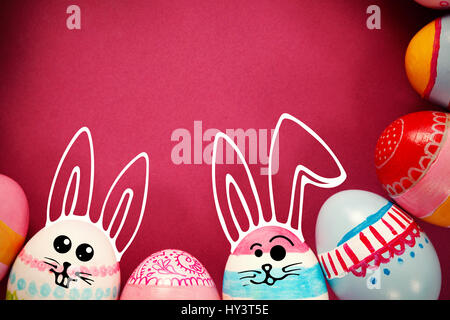 PE047 butterfly 02 bs nf against various easter eggs arranged on pink background Stock Photo