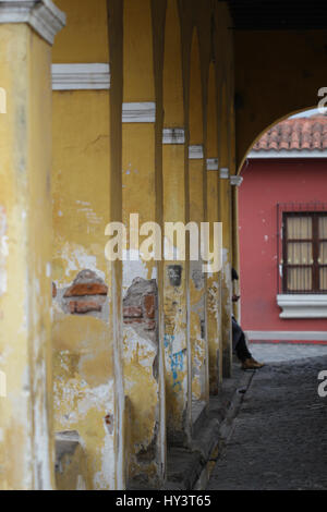 Streets in Antigua Guatemala tiny houses shops and people Stock Photo