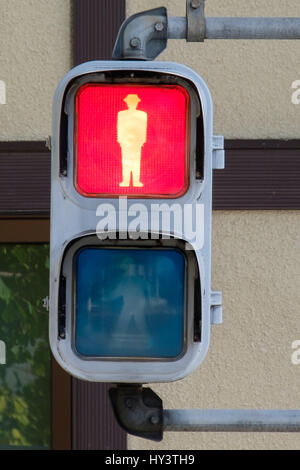 Japanese red pedestrian sign with silhouette of man Stock Photo