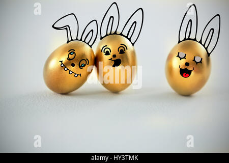 PE047 butterfly 02 bs nf against golden easter eggs on white background Stock Photo