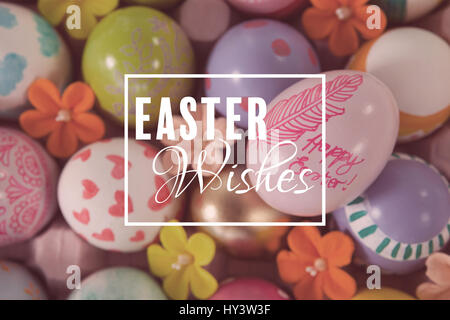 Easter greeting against painted easter eggs with different designs Stock Photo