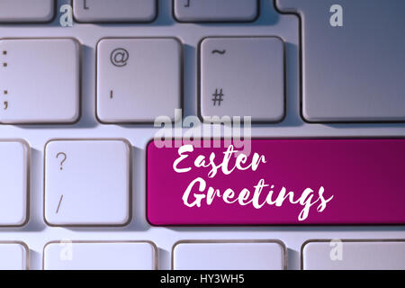 Easter greeting against pink key on keyboard Stock Photo