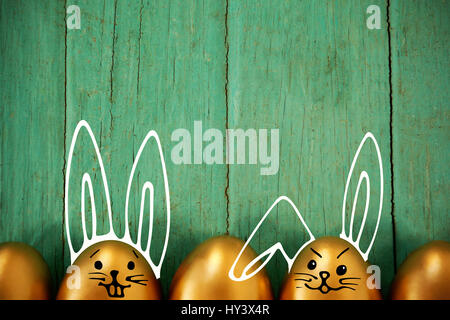 PE047 butterfly 02 bs nf against golden easter eggs arranged on wooden surface Stock Photo