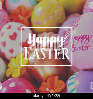 Easter greeting against painted easter eggs with different designs Stock Photo