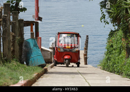 Three wheel taxi, also known as a Tuc Tuc In Guatemala Antigua, lake atitlan is the most common  transportation method serves well for tourists Stock Photo