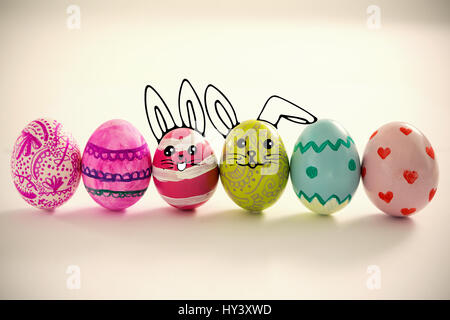 PE047 butterfly 02 bs nf against painted easter eggs arranged in row Stock Photo