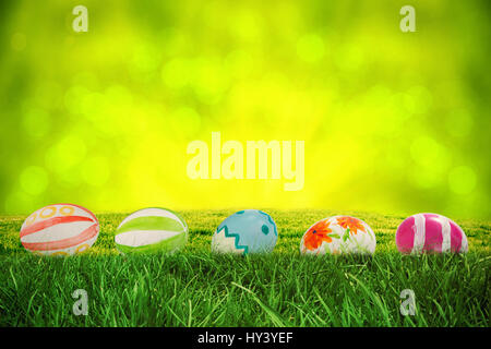Grass against field against glowing lights Stock Photo