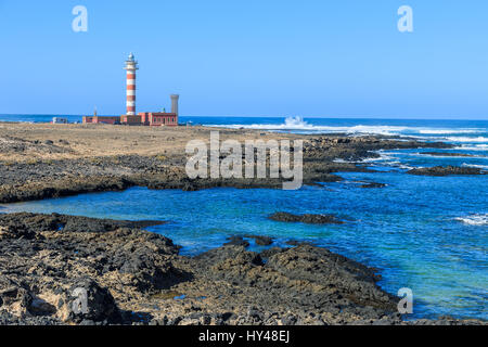 Lighthouse building on coast of Fuerteventura island on Punta de Toston near El Cotillo town, Canary Islands, Spain Stock Photo