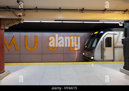 Train arriving at Museum subway station platform / metro station, tube station, TTC subway in downtown Toronto, Ontario, Canada. Stock Photo