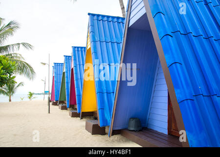 Wooden bungalows on a tropical sandy beach Stock Photo