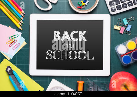 Back to school supplies. Books and chalkboard. Stock Photo