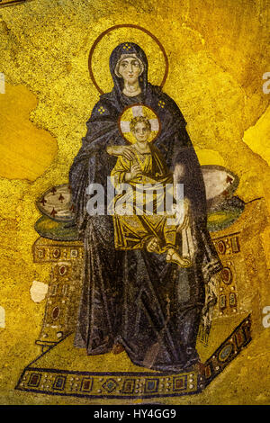 Virgin Mary and the baby Jesus sitting on a throne. Mosaic in Hagia Sofia, Istanbul - October 9, 2013 Stock Photo