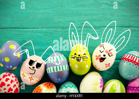 PE047 butterfly 02 bs nf against painted easter eggs on wooden surface Stock Photo