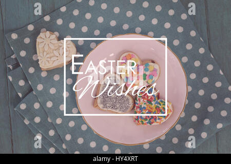 Easter greeting against various gingerbread cookies served in plate Stock Photo