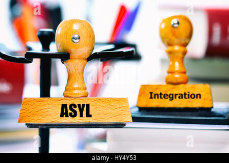 Stamp with the label Asylum and Integration, Stempel mit der Aufschrift Asyl und Integration Stock Photo