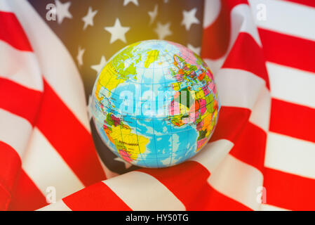Globe in a USA flag wound, American security policy, Weltkugel in eine USA-Fahne gewickelt, amerikanische Sicherheitspolitik Stock Photo