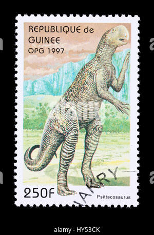 Postage stamp from Guinea depicting a psittacosaurus dinosaur Stock Photo