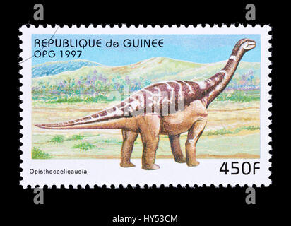 Postage stamp from Guinea depicting an opisthocoelicaudia dinosaur Stock Photo