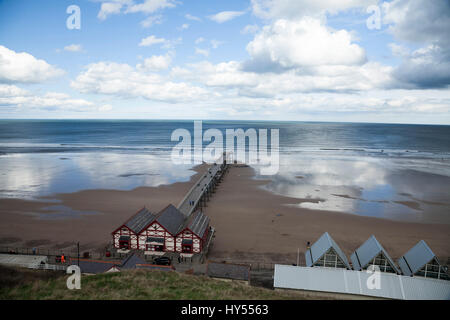 A view from the cliffs at Saltburn,England,UK, looking down at the pier and beach area Stock Photo