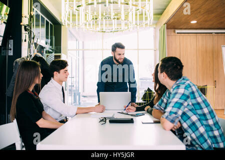 Business People Having Board Meeting In Modern Office Stock Photo