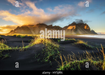 Sunset above  Vestrahorn (Batman Mountain) and its black sand beach in Iceland Stock Photo