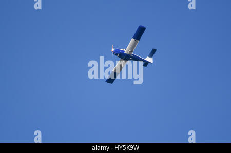 A two seater plane against a blue sky Stock Photo