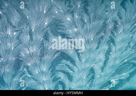 Frost tracery patterns on glass pane, Germany Stock Photo