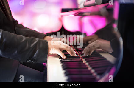 Pianist Playing Jazz Or Blues Music With Grand Piano Stock Photo