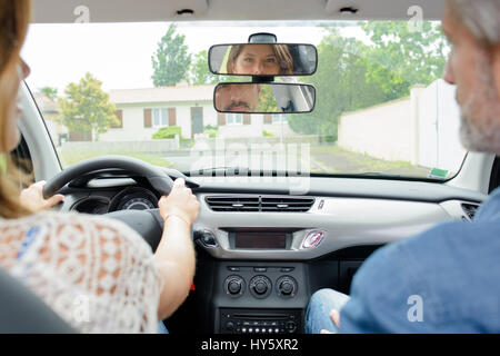 Woman having driving lesson Stock Photo