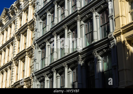 Painted 19th century facades in Manhattan's Soho neighborhood with cast iron columns and ornamentation. New York City