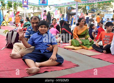 DHAKA, BANGLADESH – APRIL 01, 2017: Bangladeshi autistic children sit with their parent as they come to attend an art camp on the day of World Autism  Stock Photo