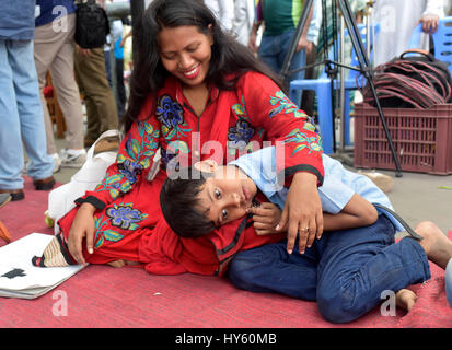 DHAKA, BANGLADESH – APRIL 01, 2017: Bangladeshi autistic children sit with their parent as they come to attend an art camp on the day of World Autism  Stock Photo