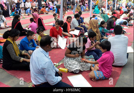 DHAKA, BANGLADESH – APRIL 01, 2017: Bangladeshi autistic children paint as they attend an art camp on the day of World Autism Awareness Day in Dhaka,  Stock Photo