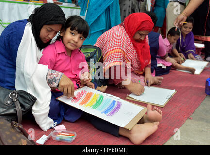 DHAKA, BANGLADESH – APRIL 01, 2017: Bangladeshi autistic children paint as they attend an art camp on the day of World Autism Awareness Day in Dhaka,  Stock Photo