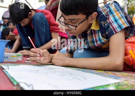 DHAKA, BANGLADESH – APRIL 01, 2017: Bangladeshi autistic children paint as they attend an art camp on the day of World Autism Awareness Day in Dhaka,  Stock Photo