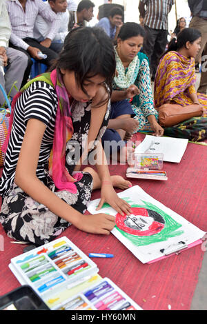 DHAKA, BANGLADESH – APRIL 01, 2017: Bangladeshi autistic children paint as they attend an art camp on the day of World Autism Awareness Day in Dhaka,  Stock Photo