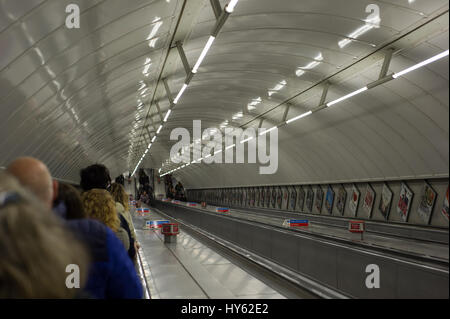 People on a London underground escalator. Stock Photo