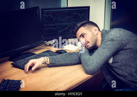 Tired bored sleepy young businessman Stock Photo