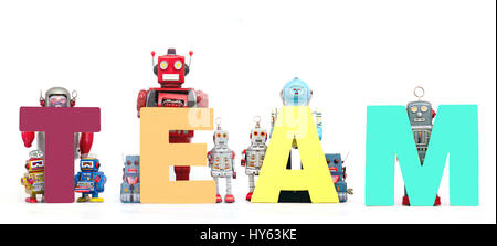 The word     TEAM  held by retro robots isolated on white Stock Photo