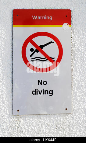 A No Diving sign on the pier in North Norfolk at Cromer, Norfolk, England, United Kingdom, Europe. Stock Photo