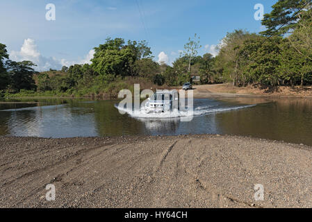 Car at a river crossing near Drake, Costa Rica Stock Photo