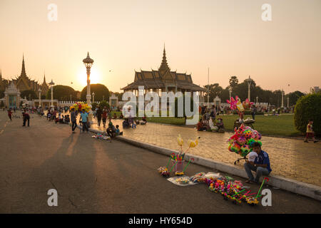 Phnom Penh, Cambodia - January 24, 2016: A man sells various toy in front of the Royal Palace in Phnom Penh, Cambodia capital city during sunset. Stock Photo