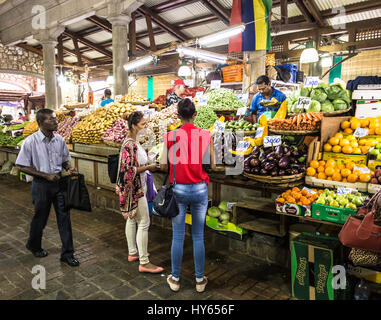 PORT LOUIS, MAURITIUS - NOVEMBER 18, 2016: People shops for fresh fruits and vegetables in the traditional fresh market of Port Louis, Mauritius capit Stock Photo