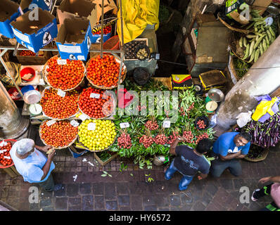 PORT LOUIS, MAURITIUS - NOVEMBER 18, 2016: People shops for fresh fruits and vegetables in the traditional fresh market of Port Louis, Mauritius capit Stock Photo