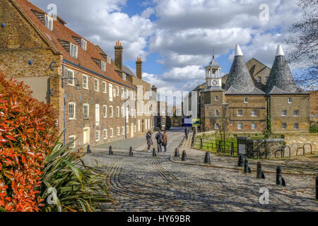 Three Mills Island, East end of London, taken on a sunny spring day and shows the Mill and the House Mill with cobbled stones. Stock Photo