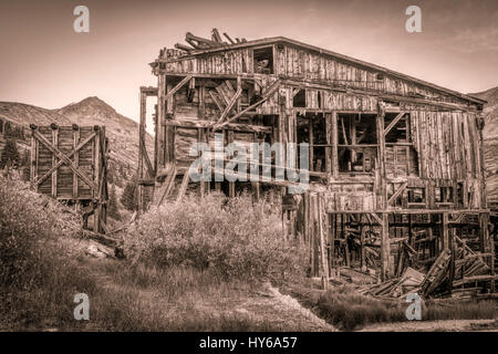 ruins of gold mine  (processing mill) near Mosquito Pass in Rocky Mountains, Colorado, sepia toning Stock Photo