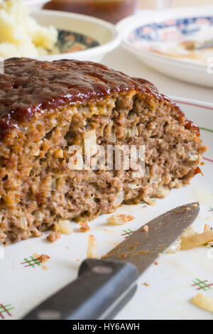 Classic American meatloaf made with ground beef oatmeal onions and a ketchup brown sugar and mustard glaze Stock Photo