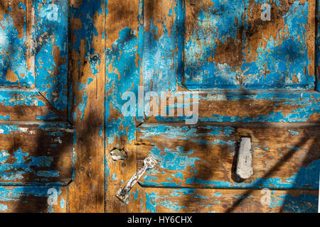 Old blue wooden door  background with shadows. Stock Photo