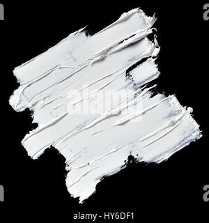 White oil paint textured brush strokes isolated on black background Stock Photo