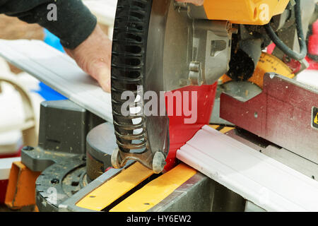 Circular saw blade cutting window fiber glass extruded profile circular saw for cutting wood Stock Photo